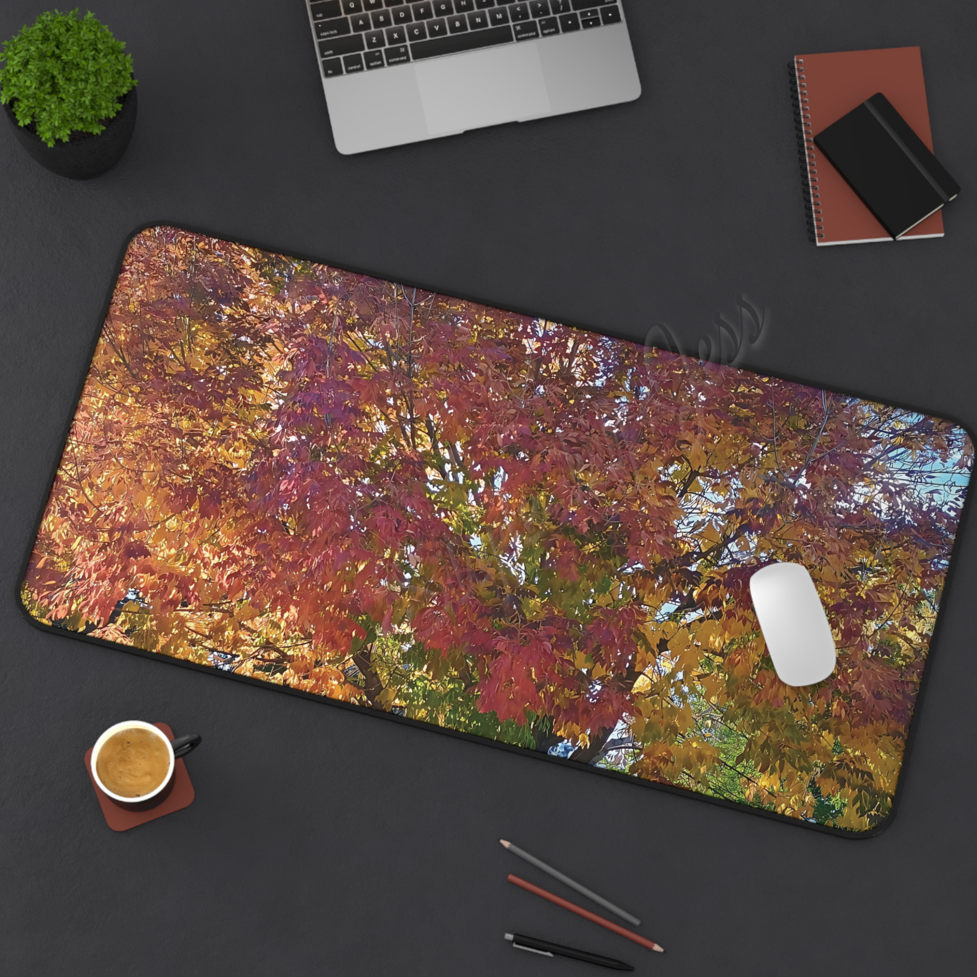 Colorful abstract mouse pad on a dark surface with office items boho decor.