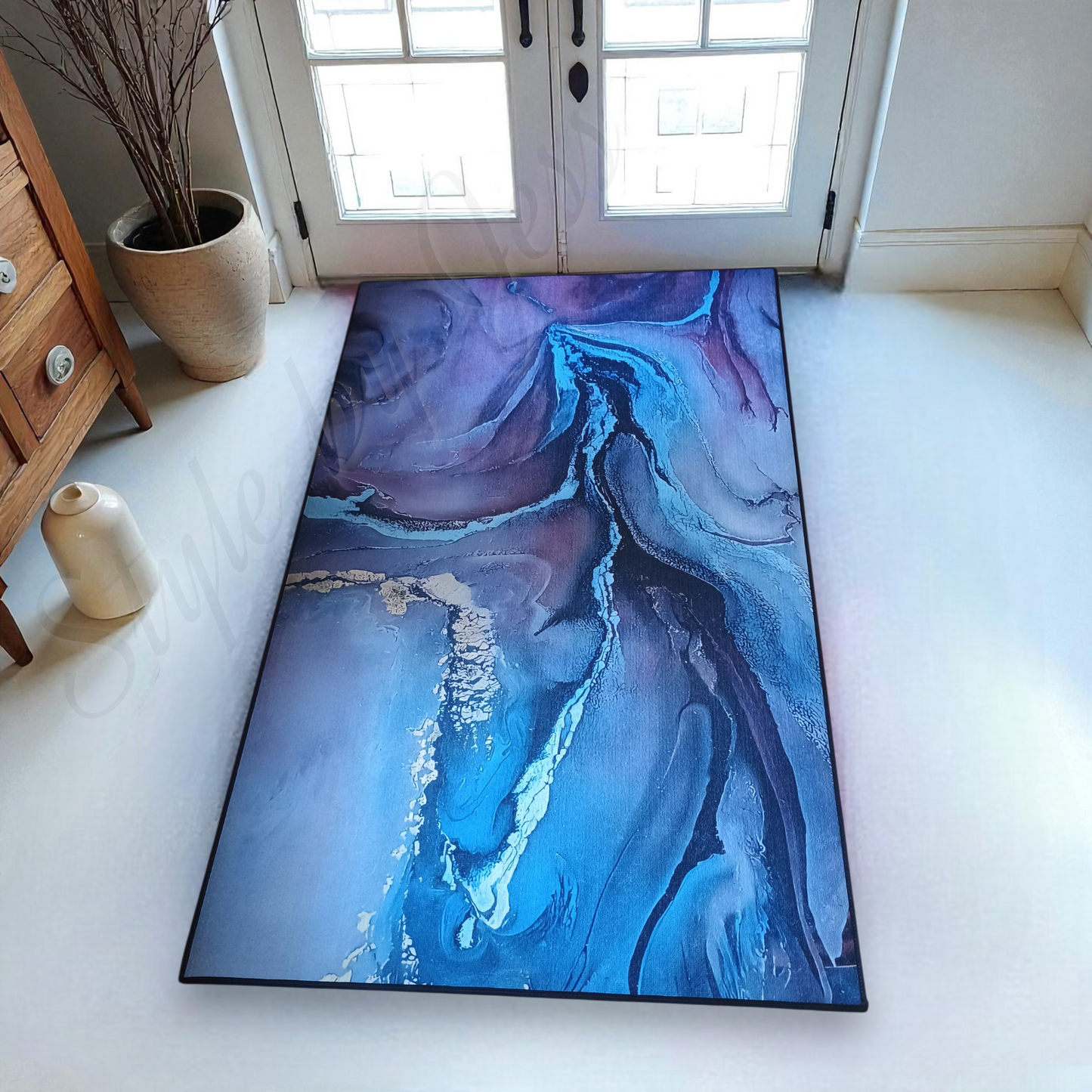 Blue and purple abstract patterned rug on a white floor