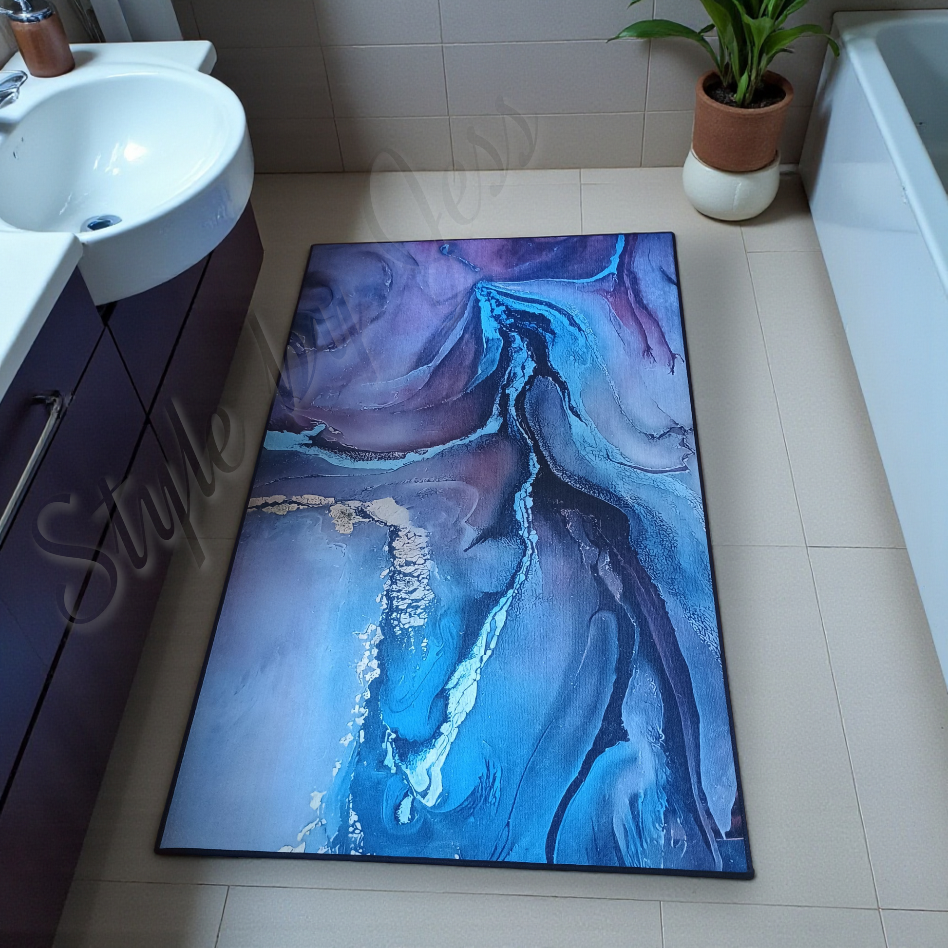 Bathroom with a colorful abstract rug on the floor Style By Jess