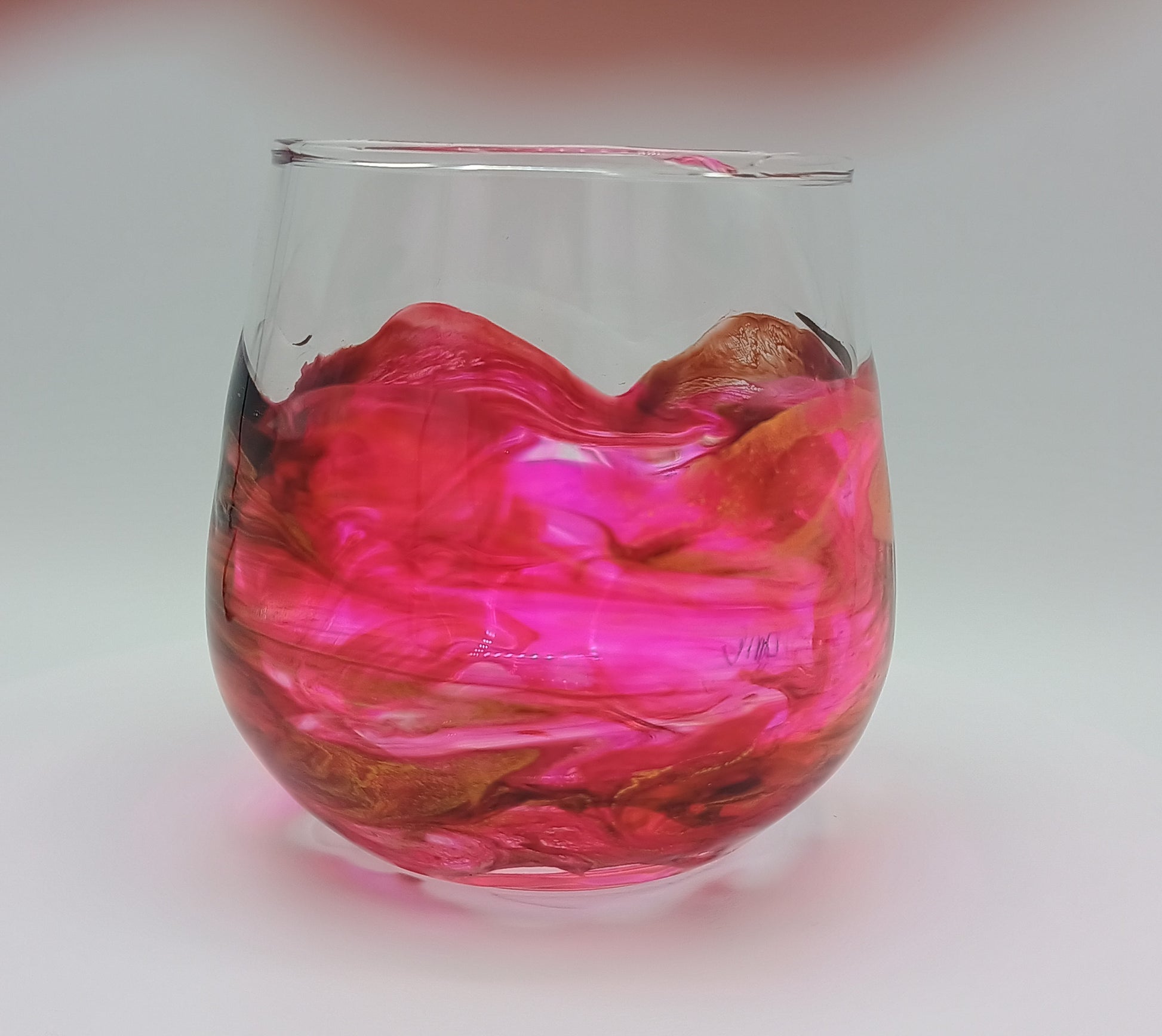 High Ball Glass with pink and brown marbled design on a white background