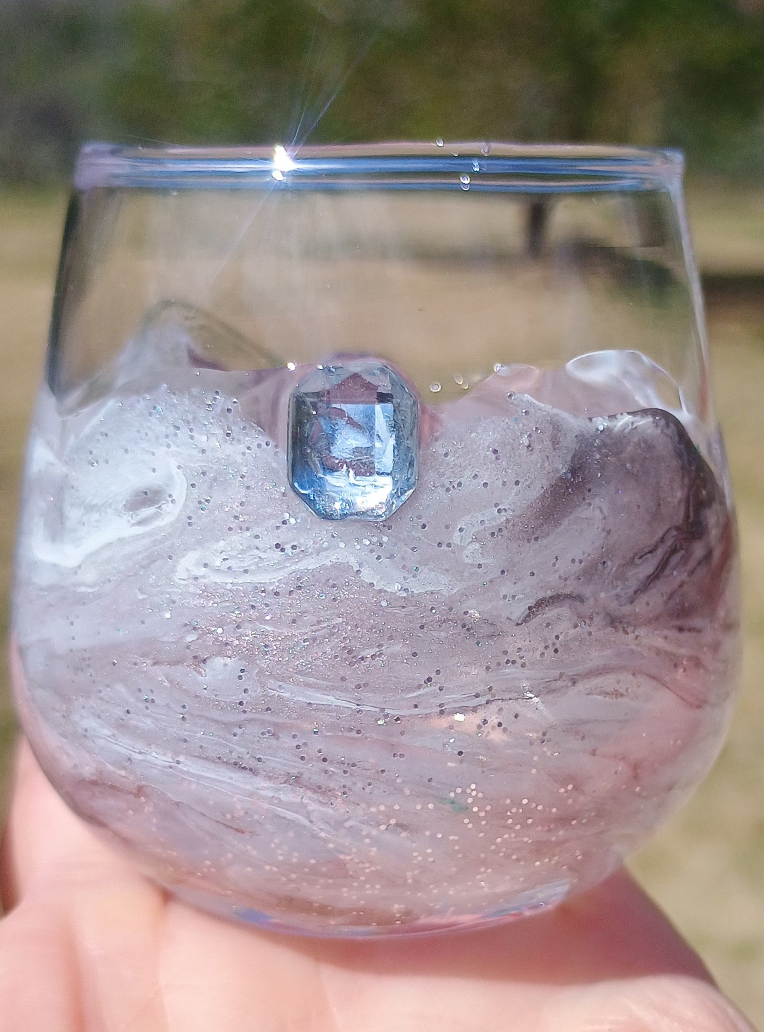 Handheld shot glass with marbled design and a clear gemstone a handmade Style by Jess with Gotta Have It Design