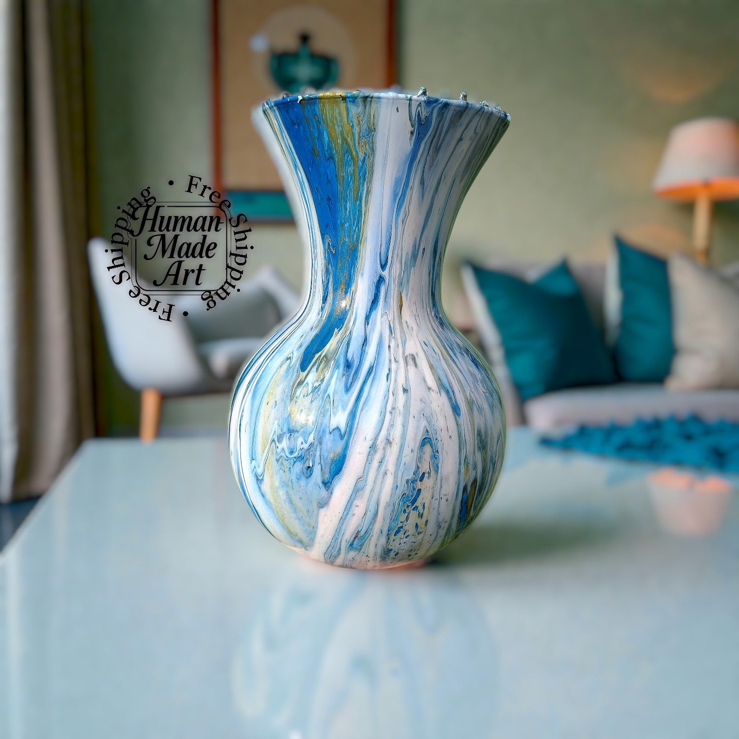 Marbled blue and white vase on a table with a blurred living room background