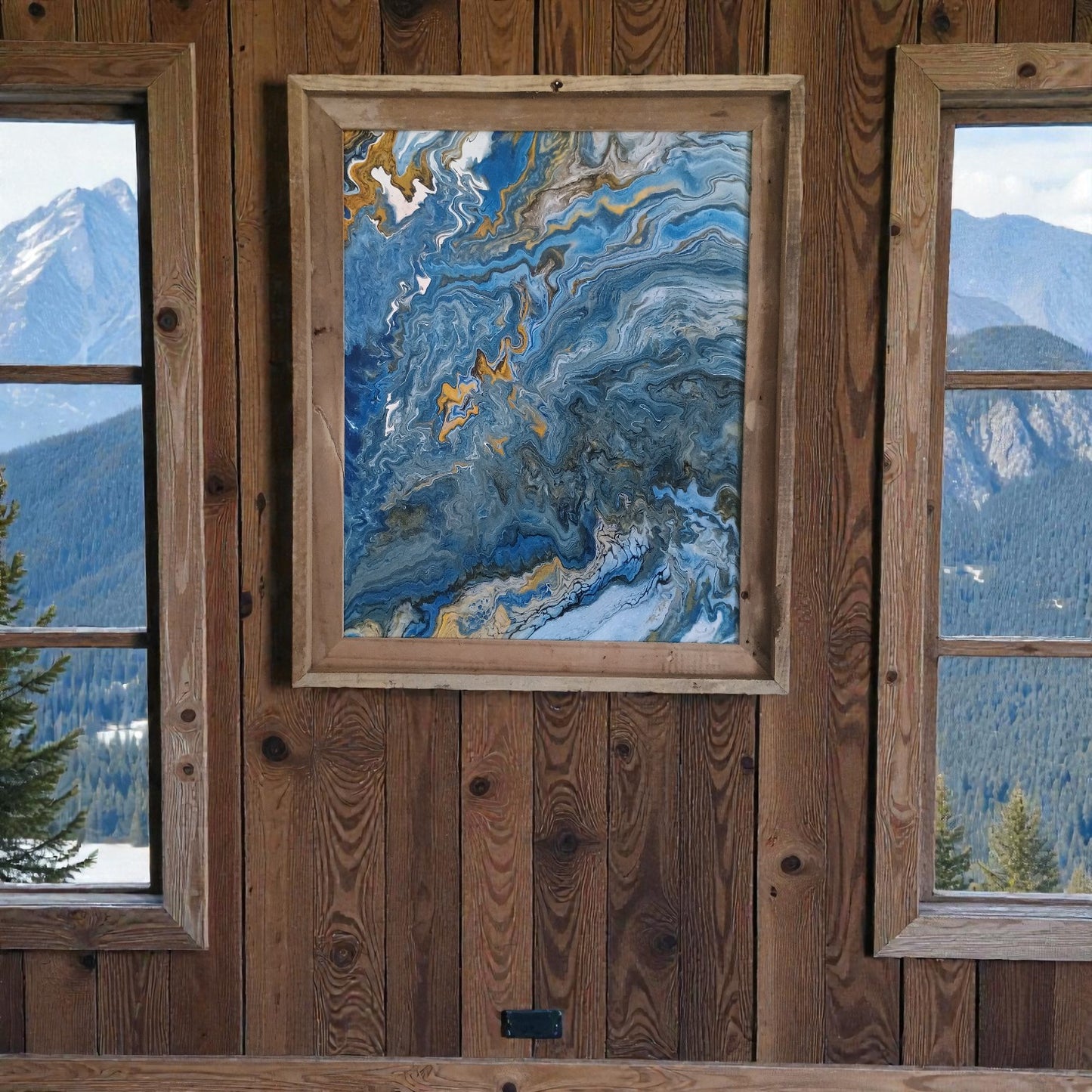 Framed abstract painting on a wooden wall with mountain views through windows a Colorado Original Artist piece a Style By Jess at Gotta Have It Design 
