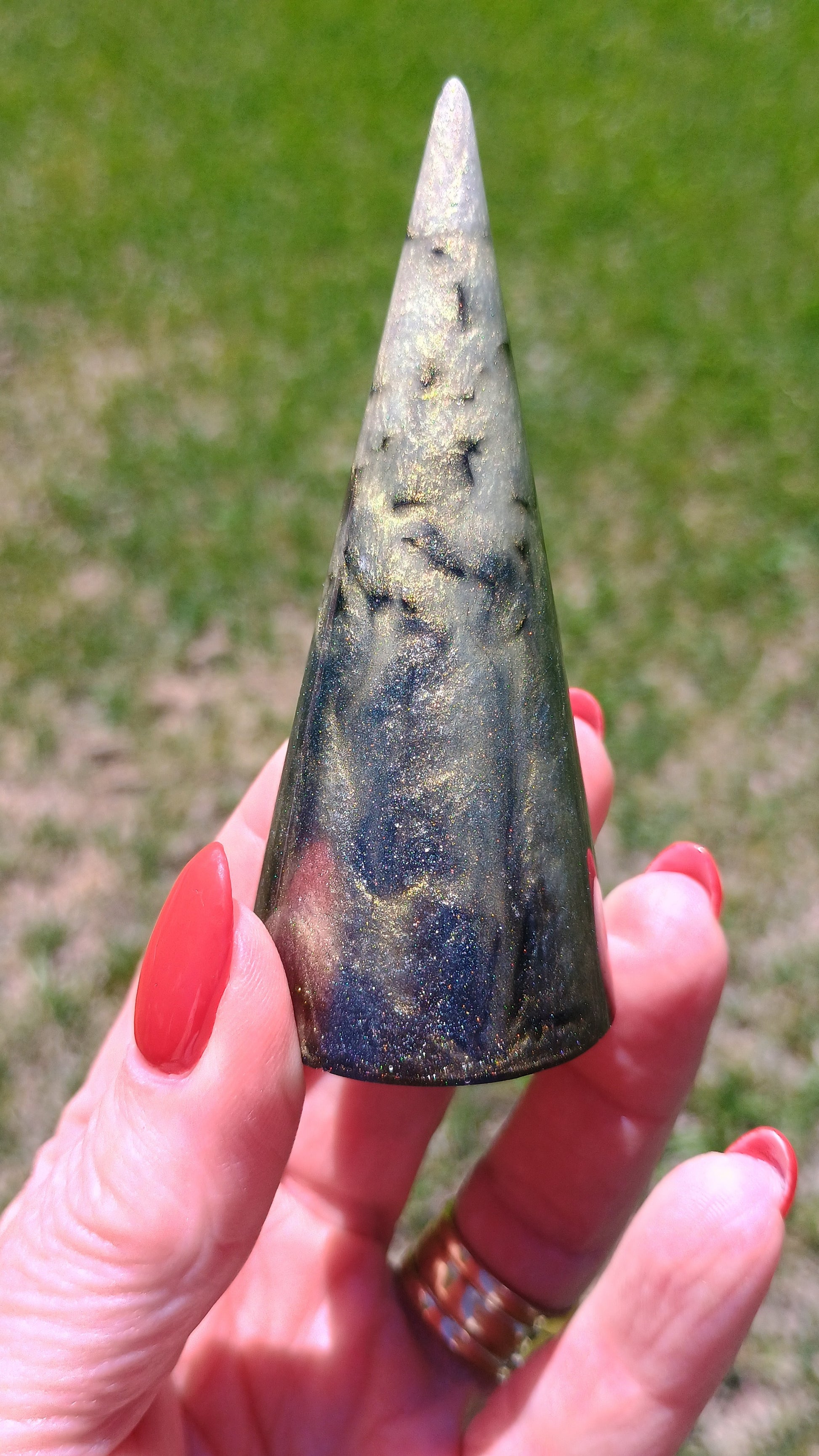 Handmade resin ring holder cone in black galaxy swirl with gold shimmer pigment and embedded black glass rock, 3.25 inches tall, one of a kind handmade resin art, custom jewelry organizer, boho vanity decor, ring dish, resin home decor by Style By Jess at Gotta Have It Design 