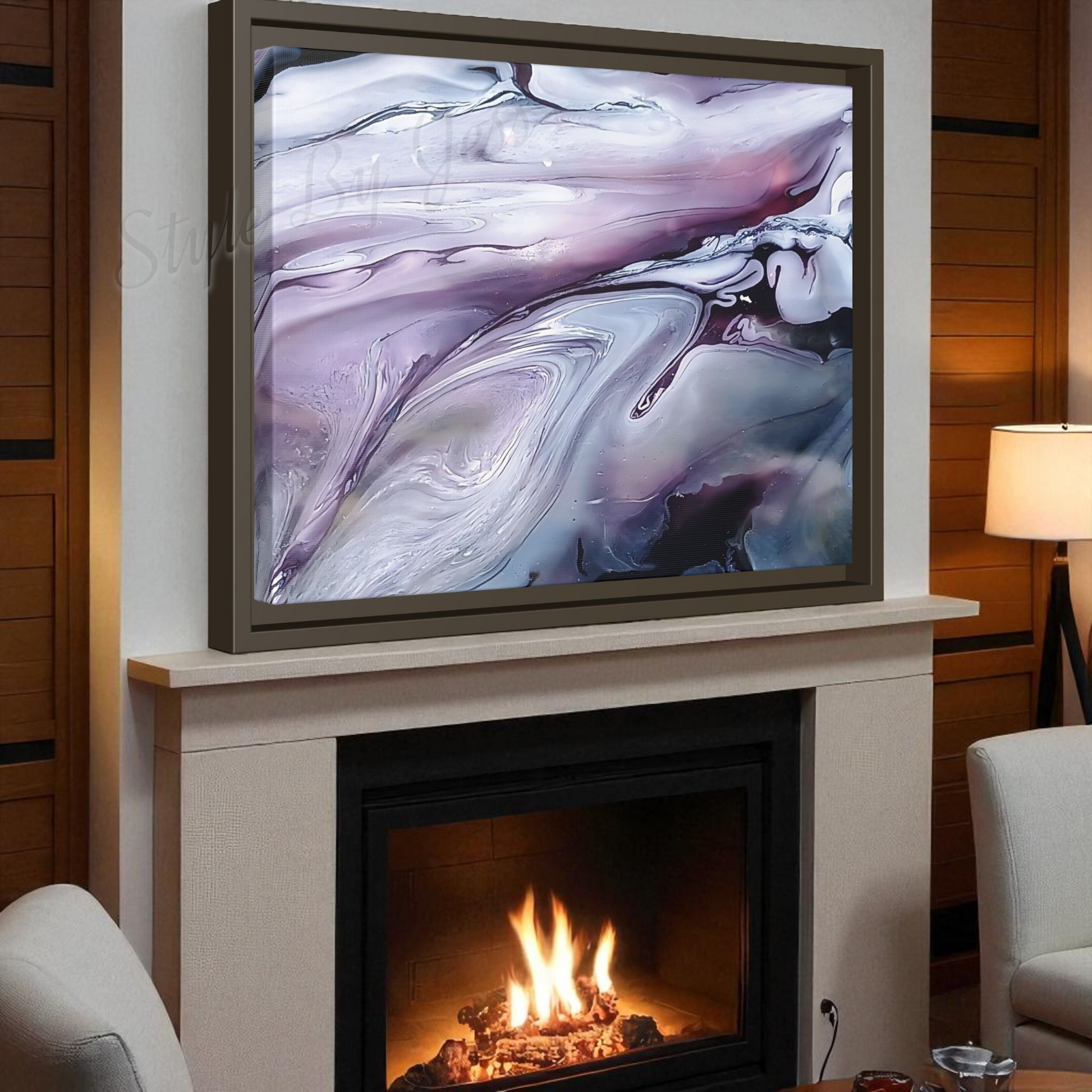 Abstract Artwork mounted above a fireplace by Style By Jess