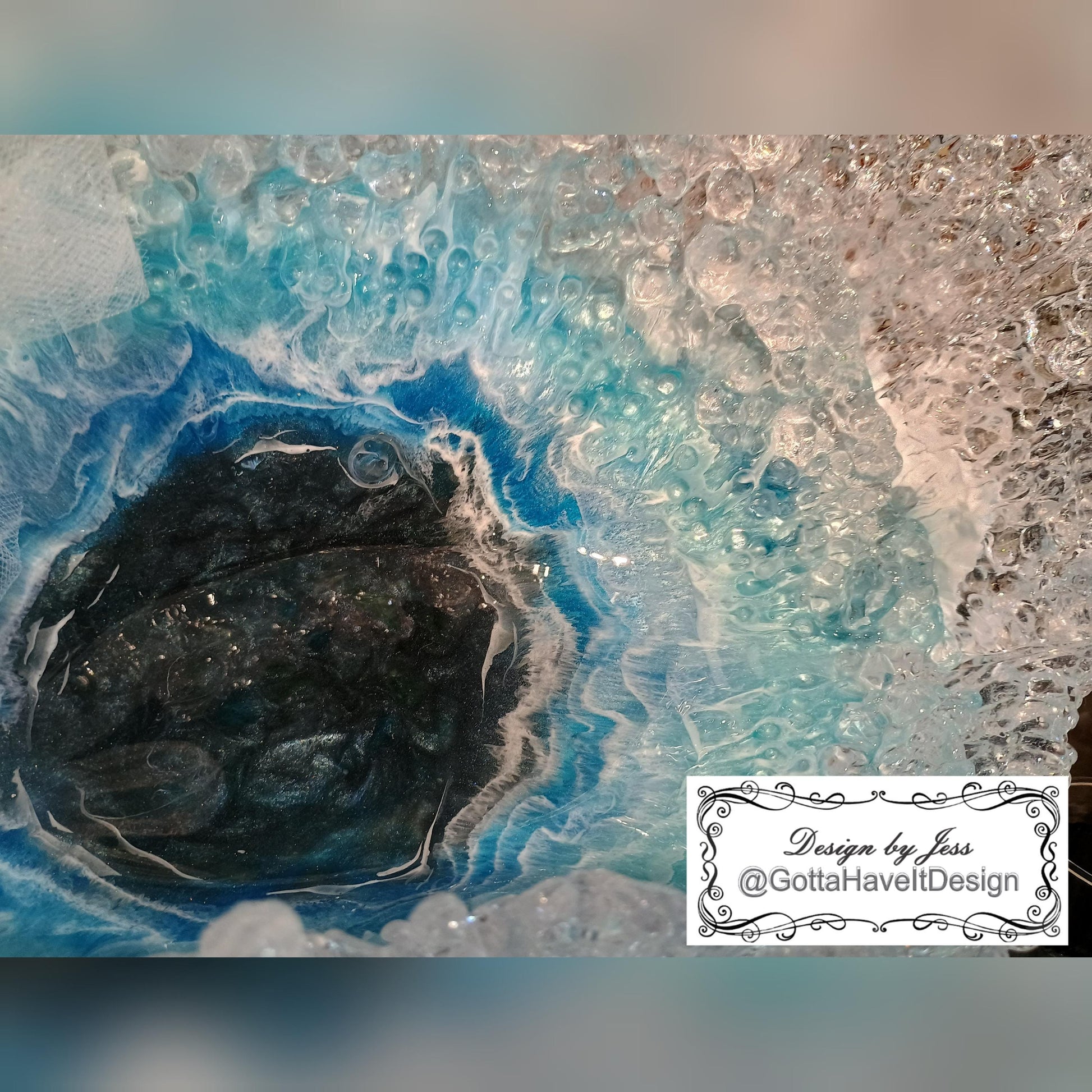 Close-up of a the interior of the center of the bowl showing the ocean bottom with waves crashing in a circle. 