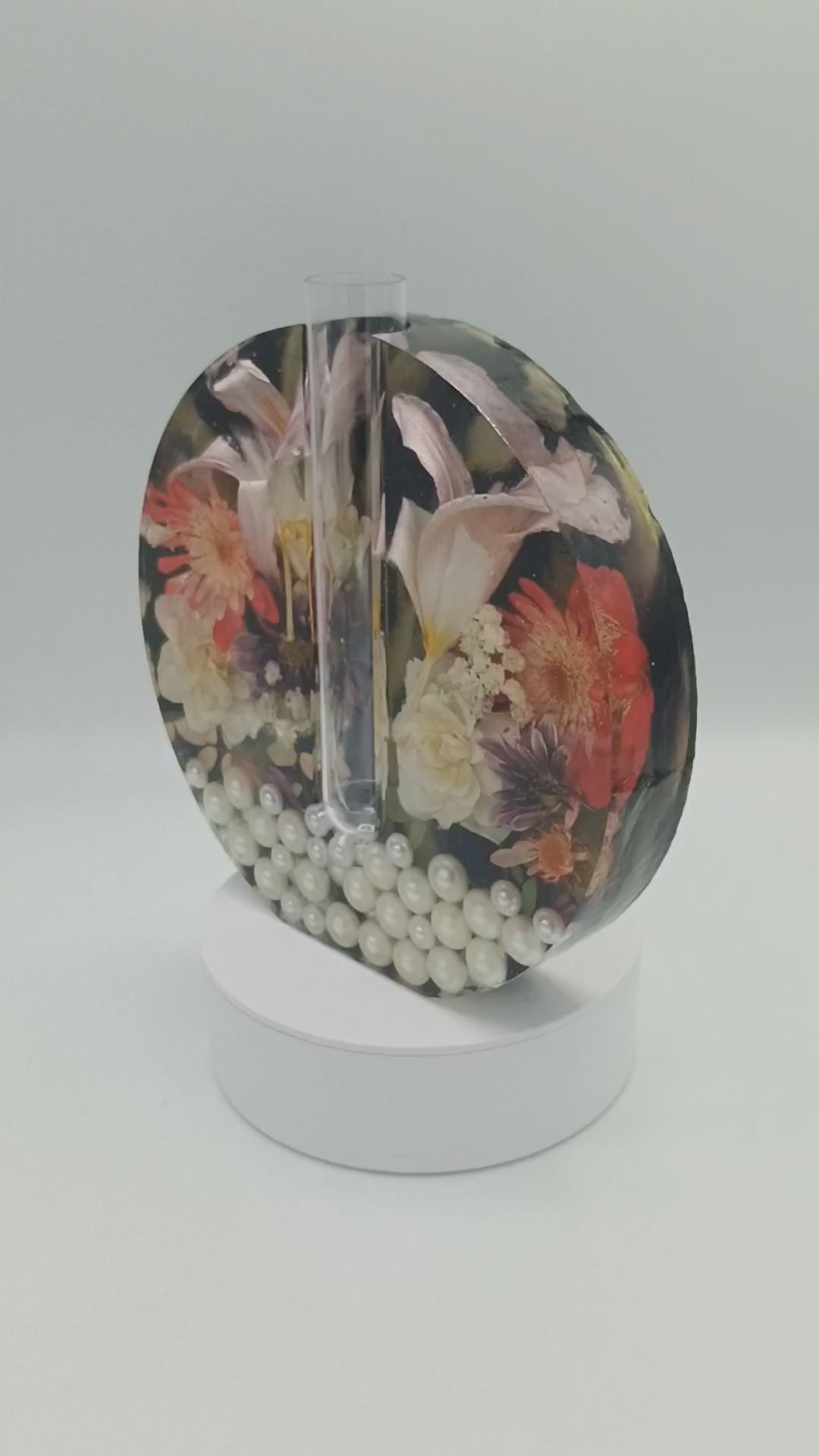 Video of handmade dried flower resin vase with garden-grown roses and lilies embedded in black and gold resin, pearl bottom, with propagation tube bud vase insert a Style By Jess at Gotta Have It Design