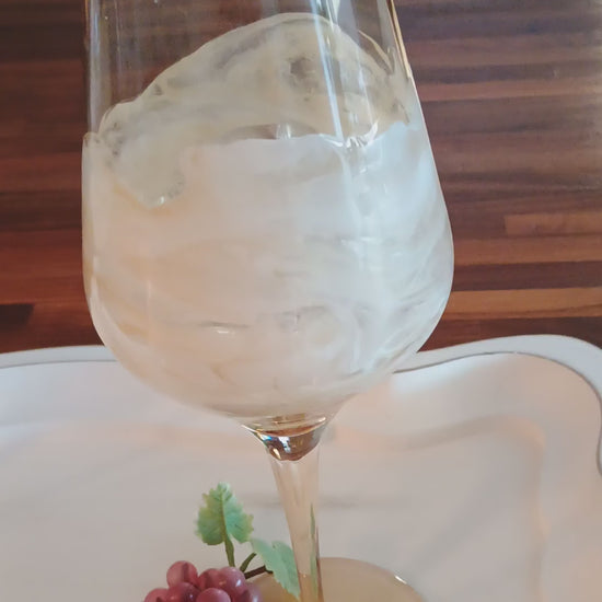Video of amber wine glass with handmade white resign marble like accents a Style by Jess