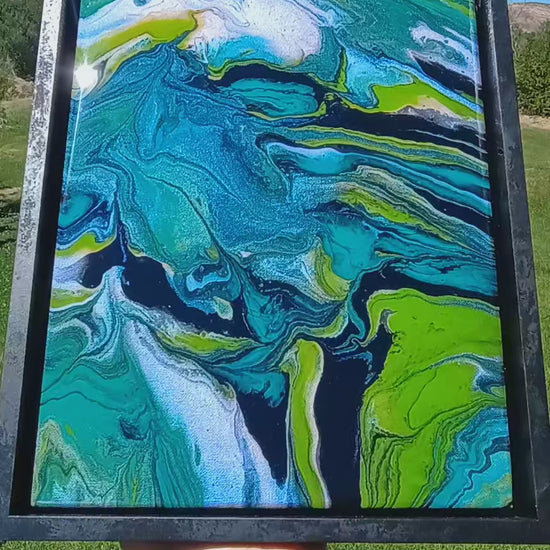 Video of abstract art painting with teal, black green and white swirls with a background of nature a Style By Jess at Gotta Have It Design. 