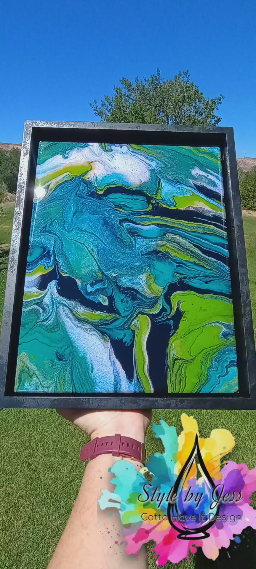 Video of abstract art painting with teal, black green and white swirls with a background of nature a Style By Jess at Gotta Have It Design. 