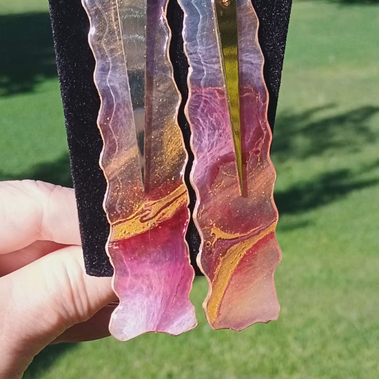 Video of abstract art handmade resin and gold earrings a Style By Jess. 