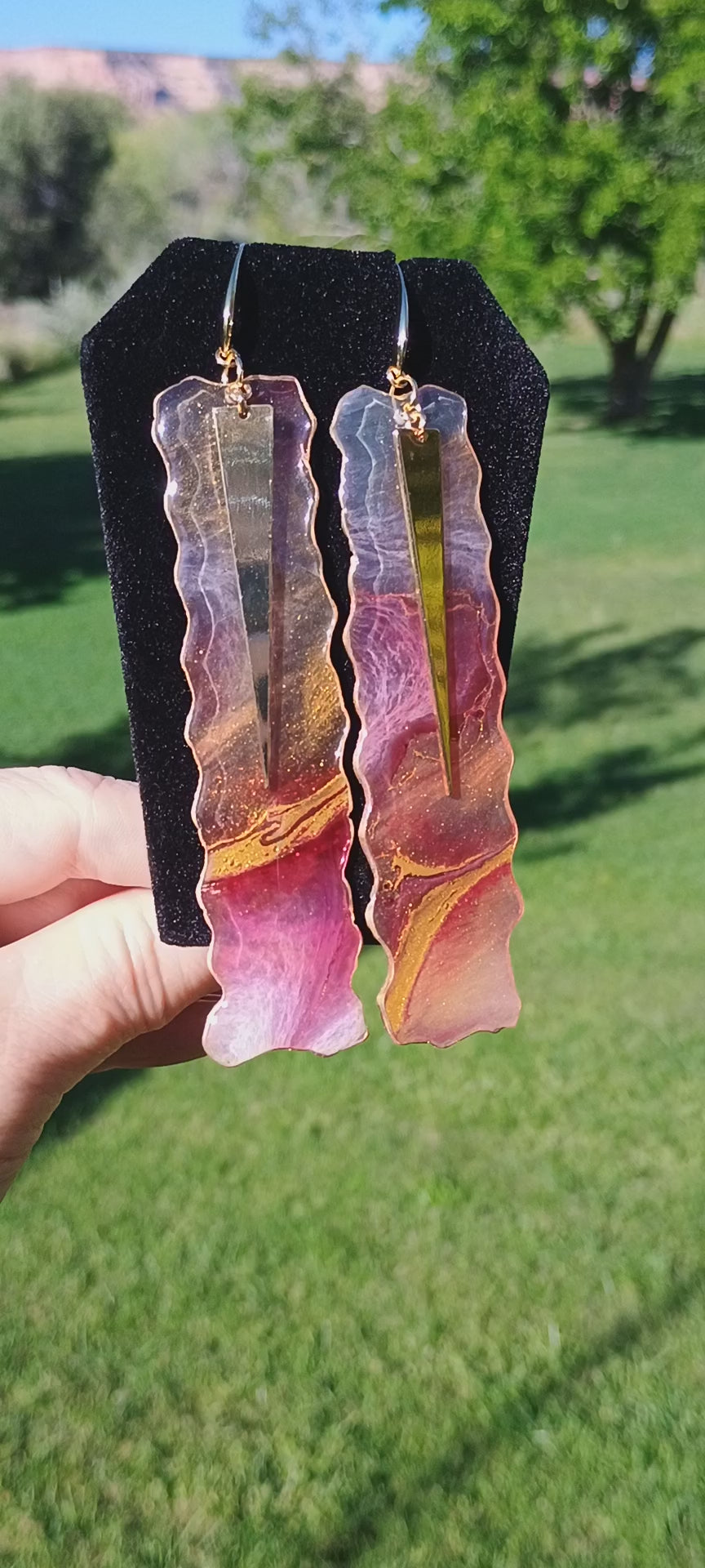 Video of abstract art handmade resin and gold earrings a Style By Jess. 
