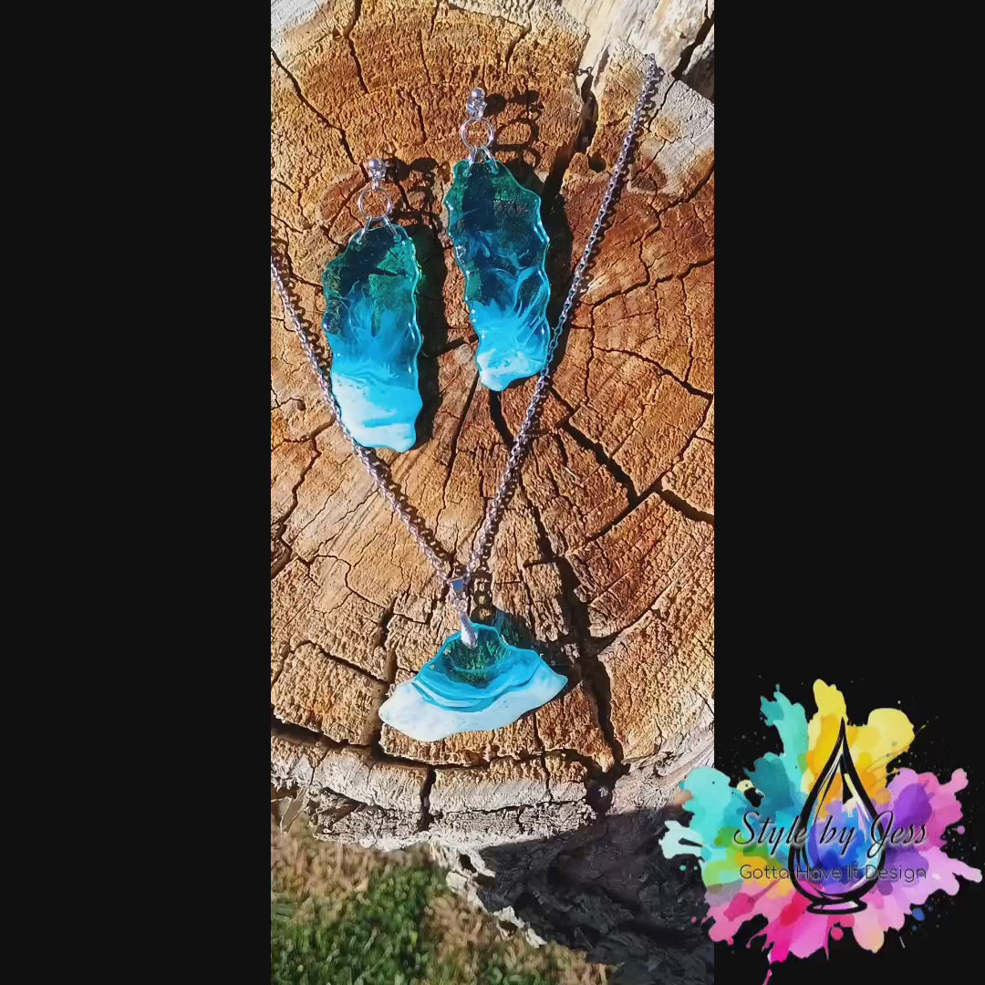 Video of blue and white dangle earrings and necklace with pendant that are ocean wave themed gift set a Style by Jess at Gotta Have It Design.