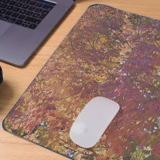Video of desk mat with a mouse and laptop excluding hemmed edges