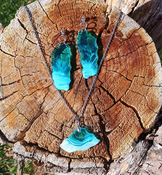 Turquoise resin dangle earrings and beach necklace on a wooden surface a Style by Jess at Gotta Have It Design