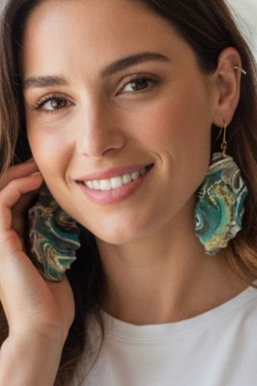 Woman wearing large one of a kind abstract geode style resin dangle  earrings with a neutral background a Style By Jess at Gotta Have It Design