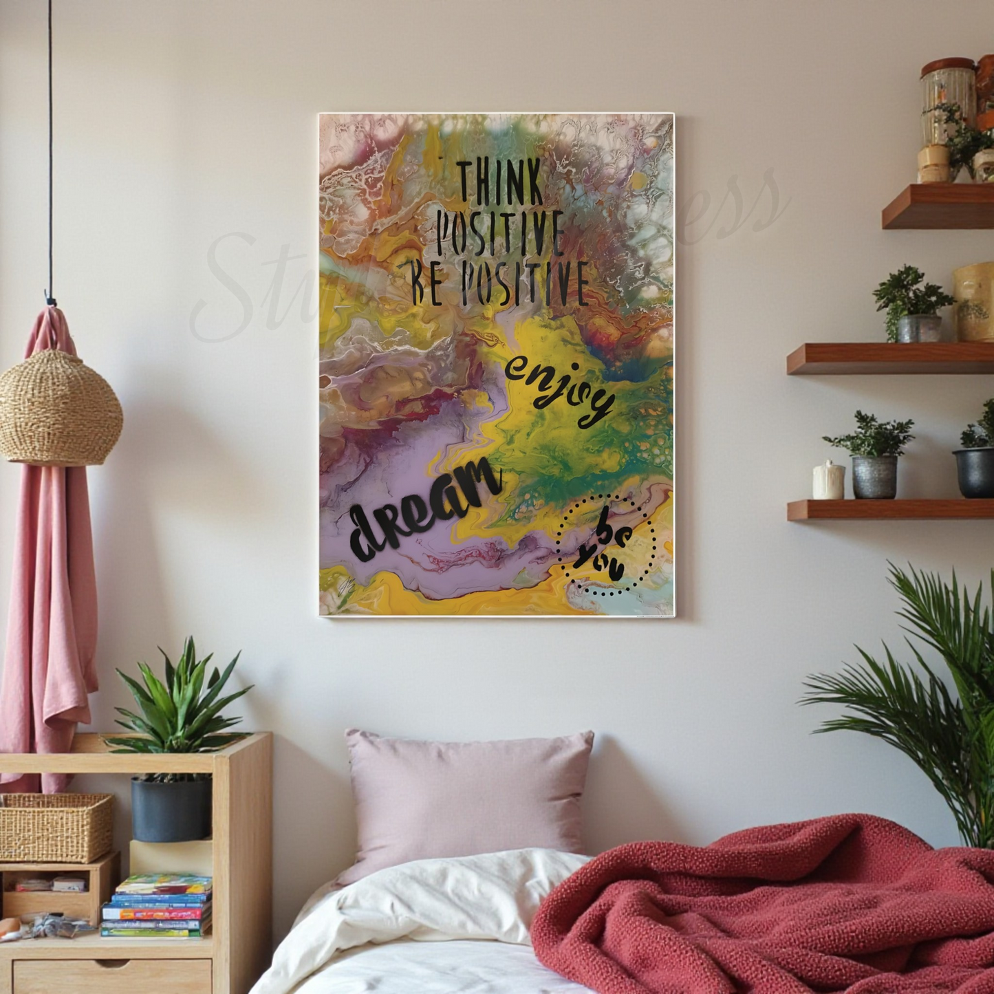 Decorative wall art with motivational phrases in a bedroom setting.