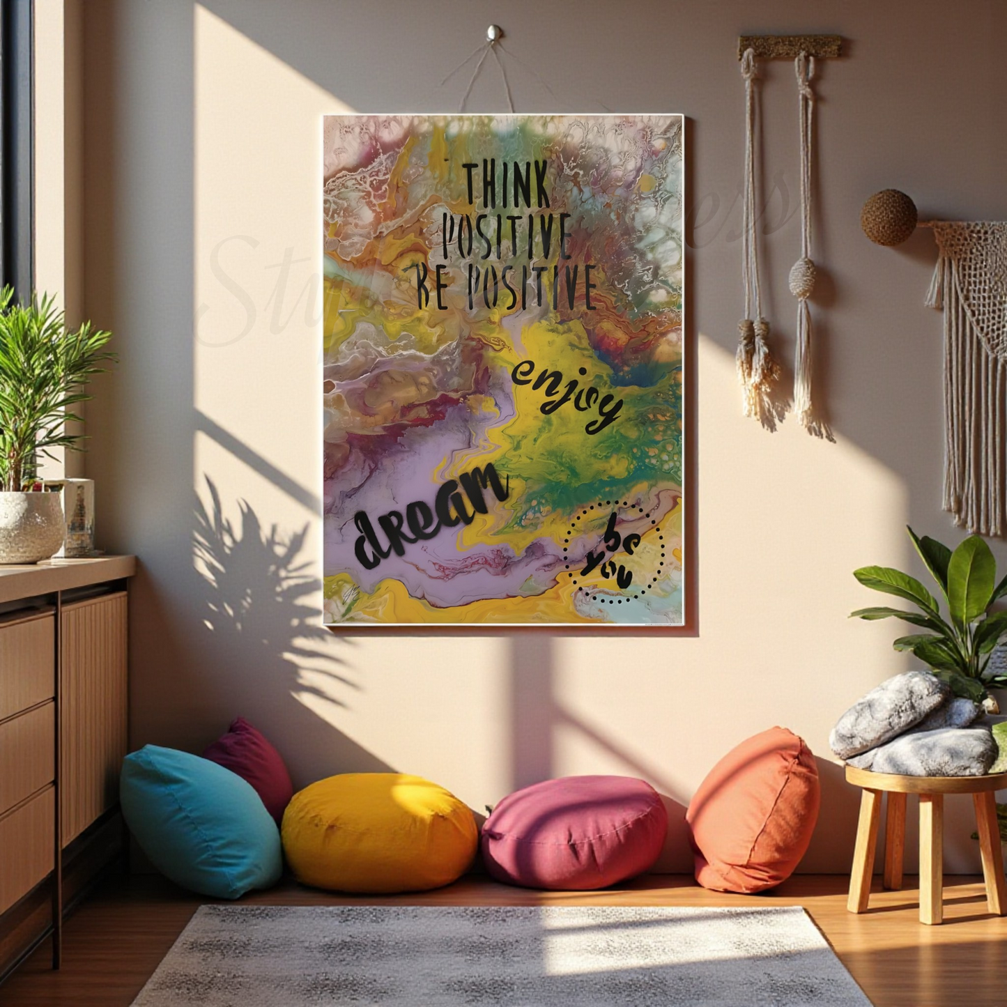 Colorful abstract wall art with motivational phrases in a room with pillows and plants.