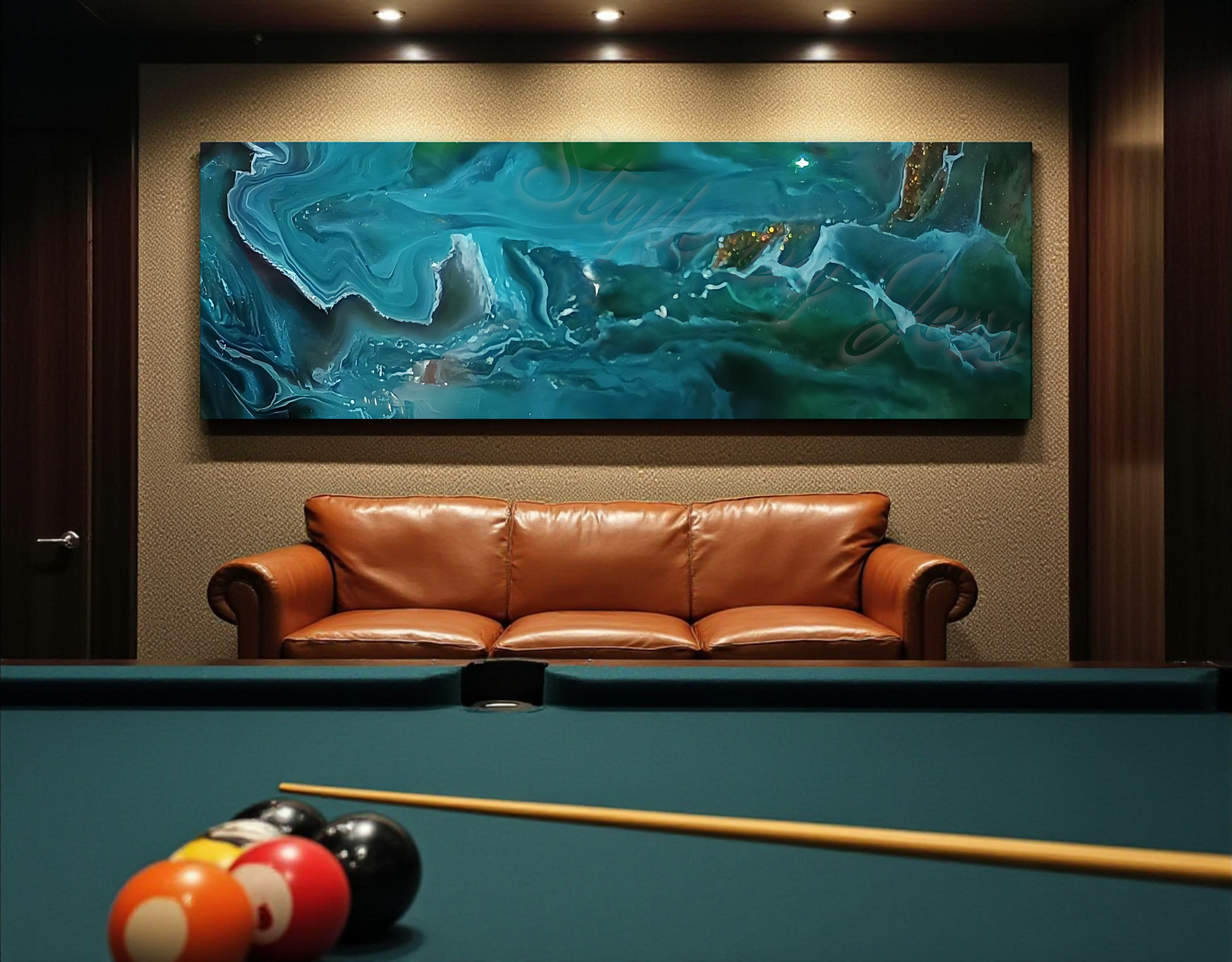 Living room with a brown leather sofa, pool table, and abstract painting on the wall.