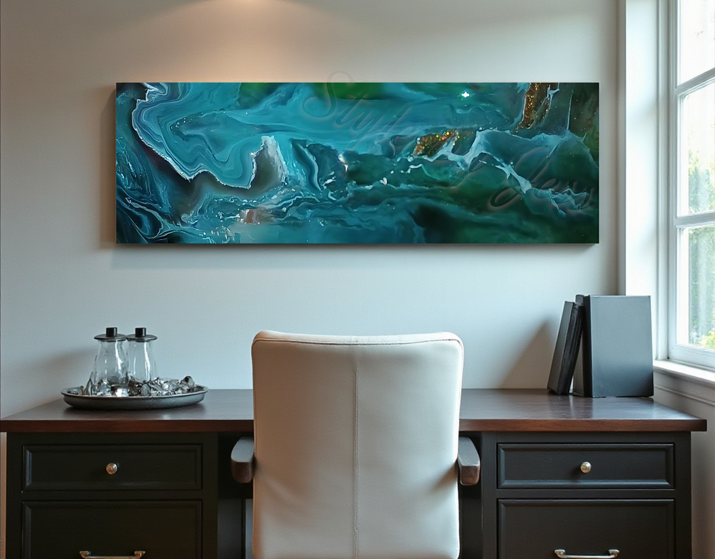 Abstract teal painting on a wall above a desk with a chair.