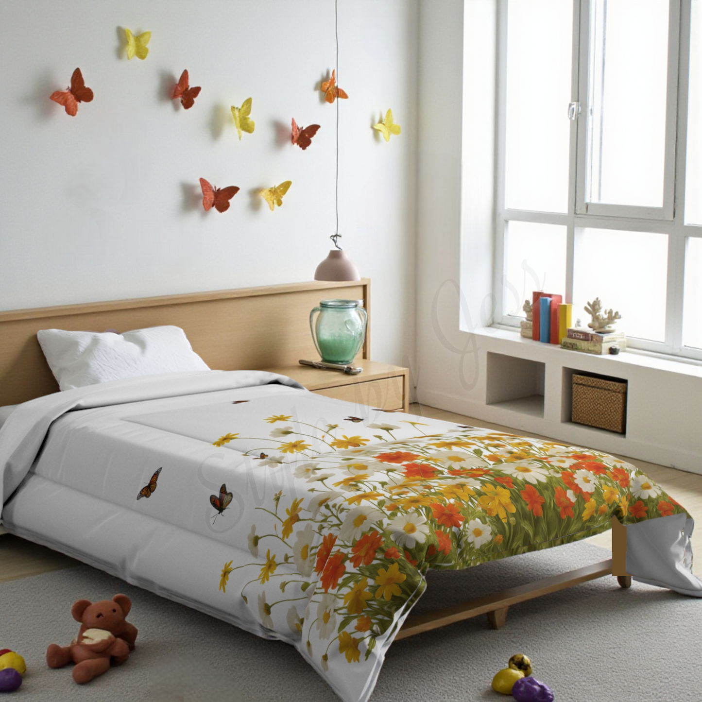 Bedroom with floral comforter, colorful butterflies on wall, and teddy bear on floor.