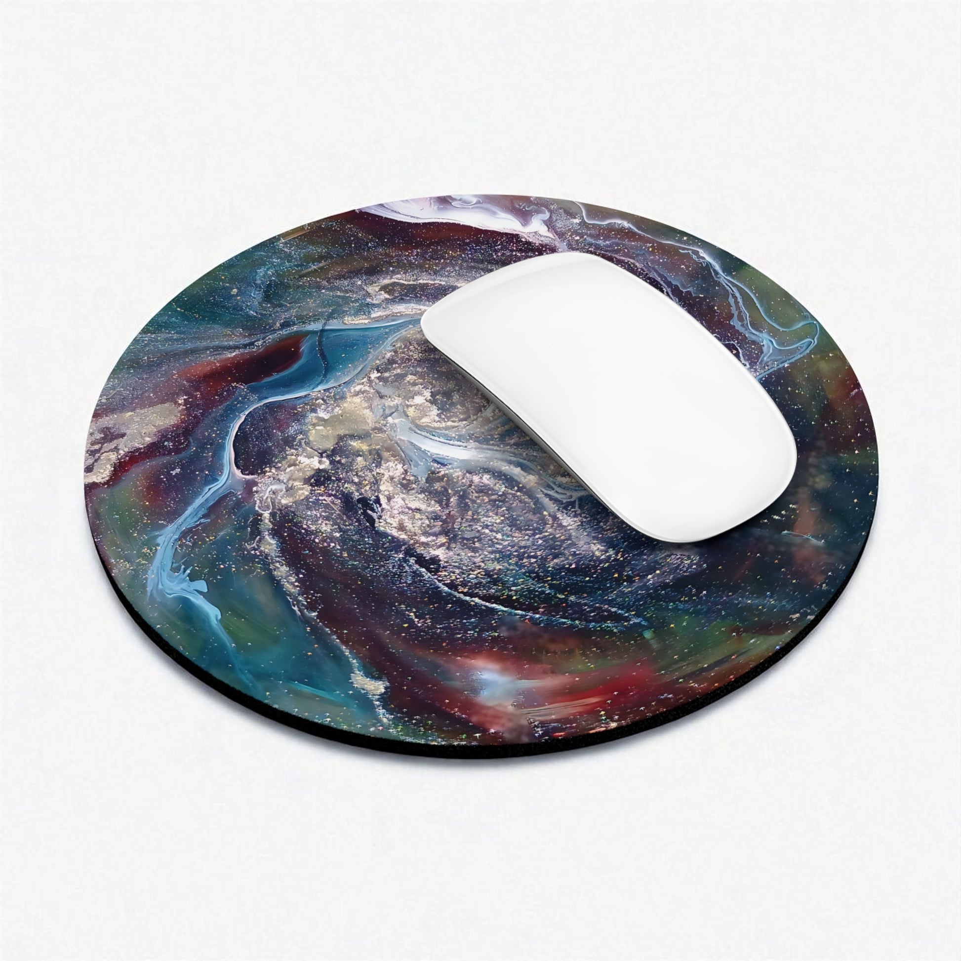 Round mouse pad with a colorful galaxy design on a white background
