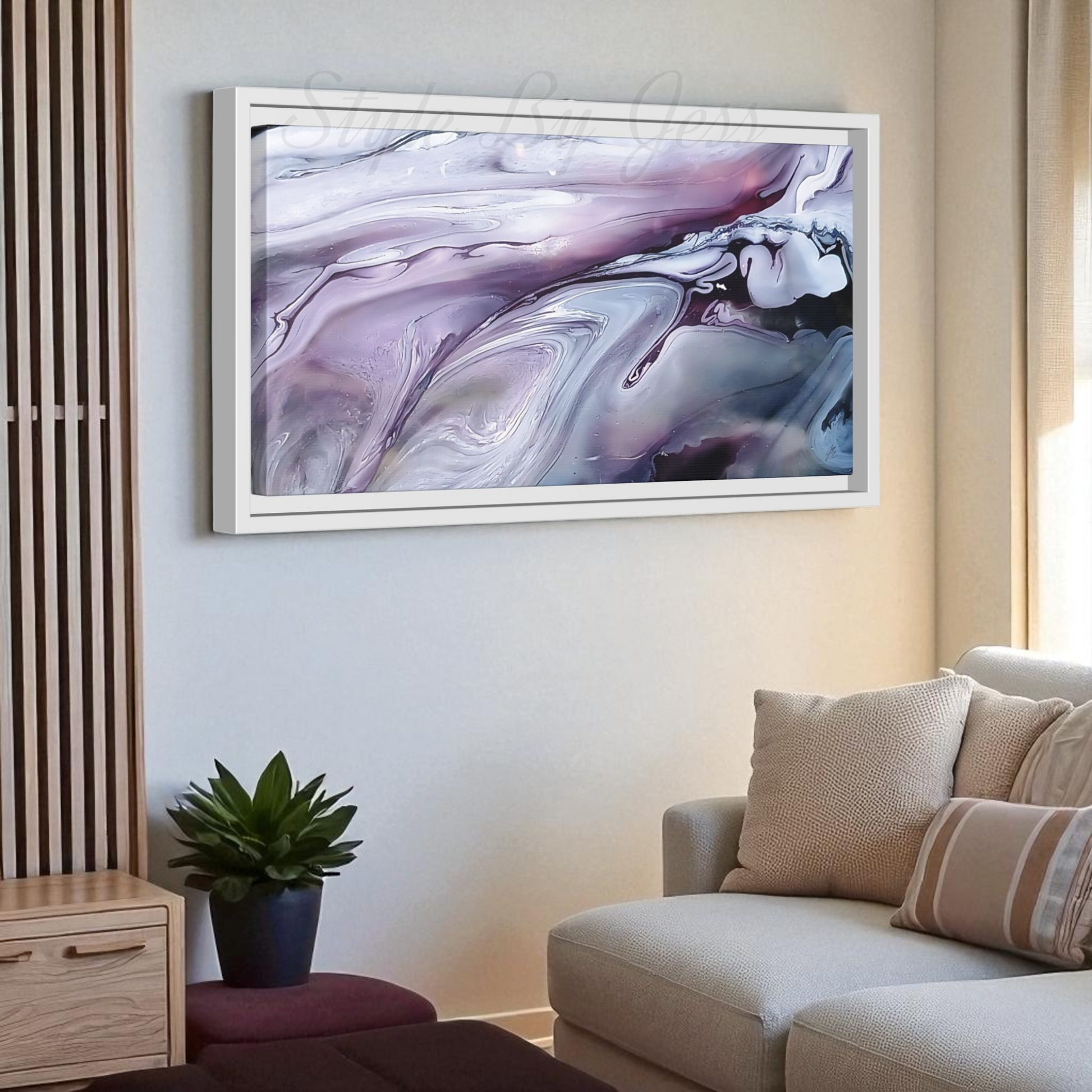 Living room with a beige sofa, plant, and abstract painting on the wall.